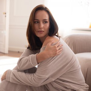 Beige velour blouse with pearls on the cuffs